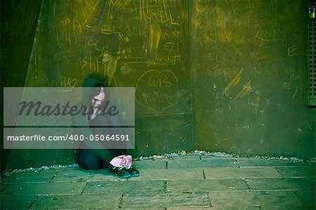 Young woman alone in urban background.