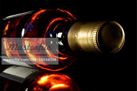 Bottle of whisky with black crisp background