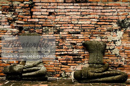 two decapitated buddhas in the ruins of the ancient thai capital of ayutthaya