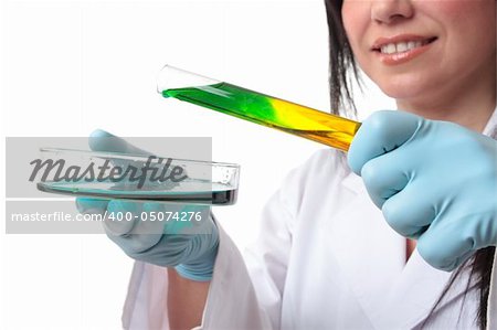 Laboratory research worker with test tube and petri dish