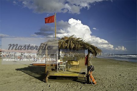 Wide hut on the beach in Italy
