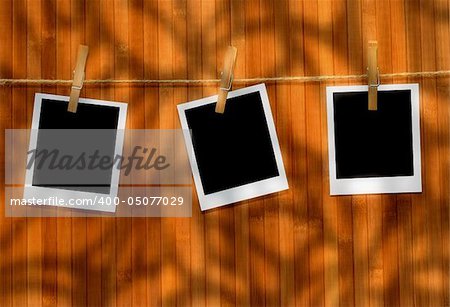 Polaroid pictures against wood background