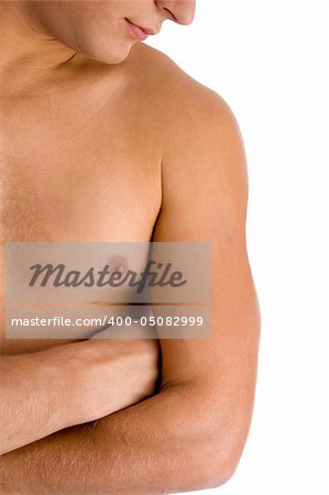 close view of man looking at his muscular arm with white background
