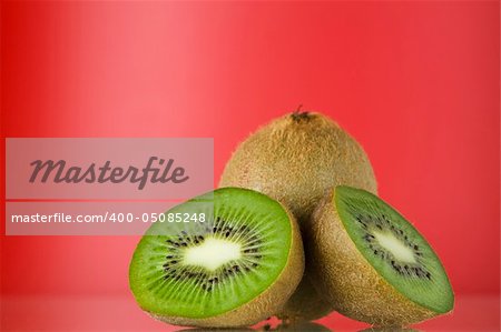 Close up view of nice fresh kiwi on red back