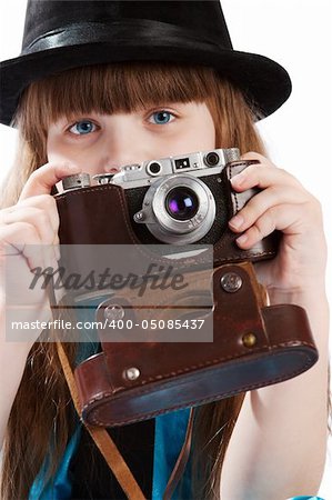 Portrait of a girl in black hat holding vintage camera