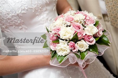 bouquet with orchids in the hands of the bride