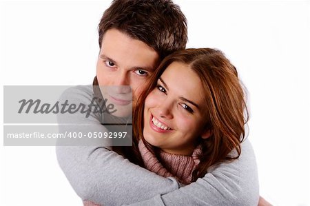 Young attractive couple passionately in love holding isolated on white