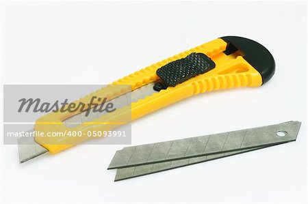 Box cutter and blades on bright background