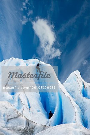 Two men climbing a glacier in patagonia.