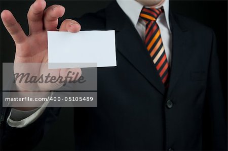 businessman holding blank card