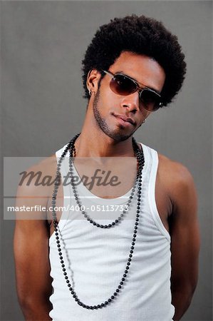 Portrait of young trendy african man posing