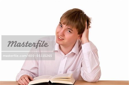 Handsome man sitting and reading in library over white background