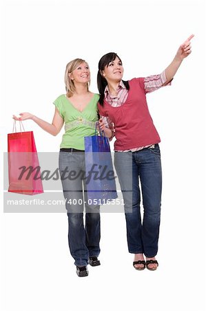 two attractive women with shopping bags. over white background