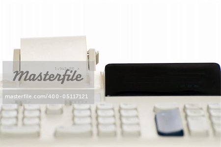 Closeup view of an adding machine, isolated against a white background