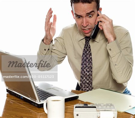 Stressed accountant talking on his cell phone, isolated against a white background