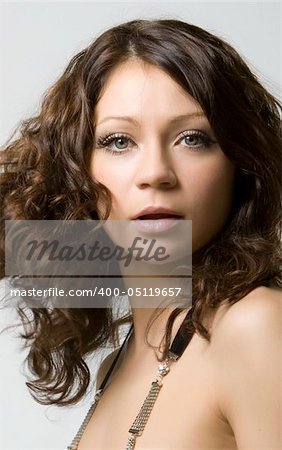Close-up portrait of a beautiful young brunette in motion
