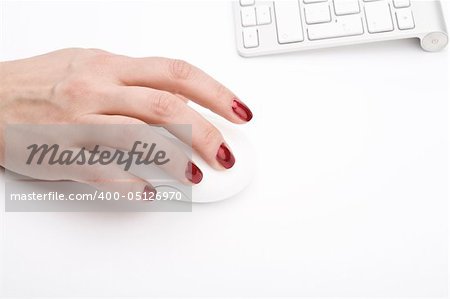 Fingers with red nail holding a mouse