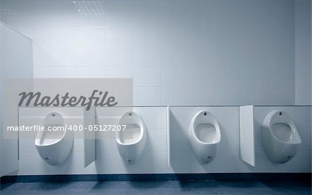 modern restroom interior photo with urinal row
