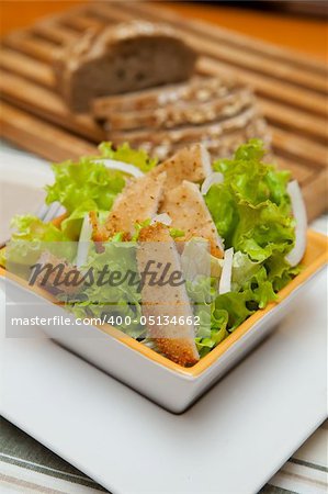 Premium caesar Salad with Crispy Chicken and onion