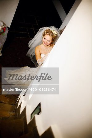 bride hides near the column