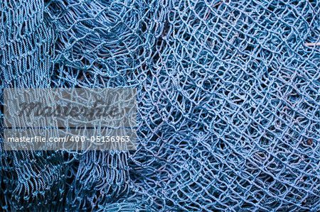 Close up of blue industrial fishing net background