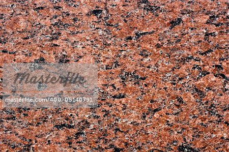 close up of a polished red marbled granite texture