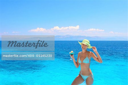 Beautiful young woman enjoying the Ionian sea in Greece