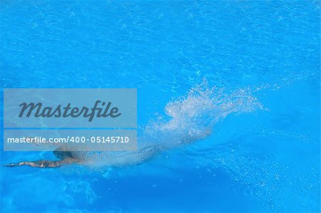 Pretty woman enjoying a swimming pool in Greece