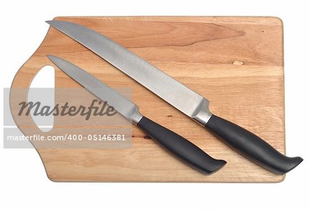 Two knives over cutting board isolated on white background