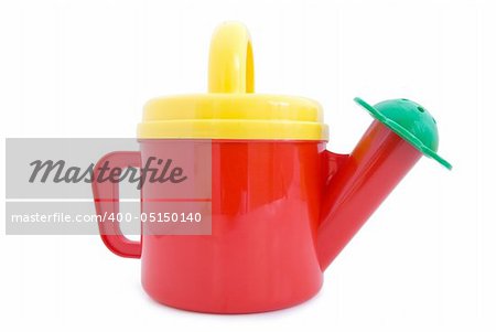 Toy watering can. Isolated on white background.