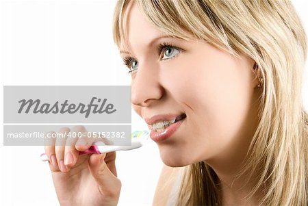 Young beautiful woman brush her teeth