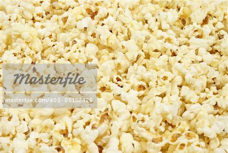 A macro shot of popcorn that is filling the frame.
