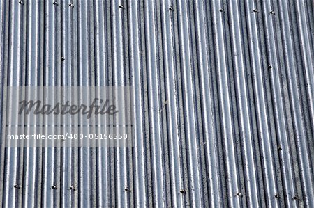 a tin roof abstract grungie background with screw heads