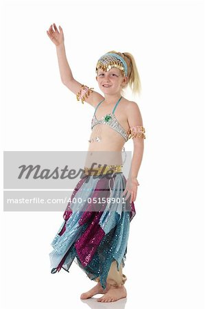 Young Caucasian belly dancing girl in beautiful decorated clothes on white background and reflective floor. Not isolated