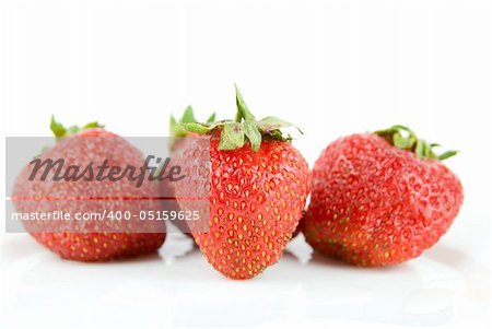 Ripe and fresh strawberries isolated on white background