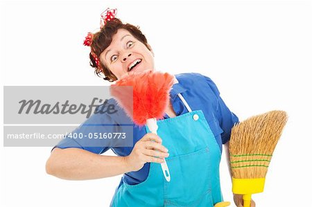 Cleaning lady with a crazy expression plays with her broom and feather duster.  Isolated on white.