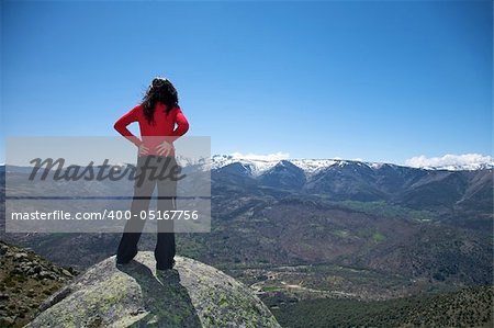 woman at the top of gredos mountains in avila spain