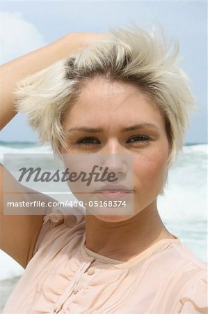 Portrait of a beautiful blond woman at the beach.