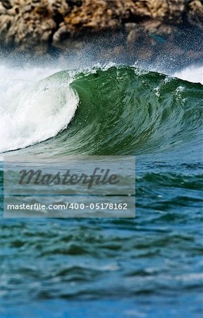 Beautiful atlantic ocean wave breaking in the sun