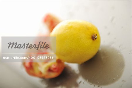 fresh and healthy fruit food lemon and Pomegranate isolated on white