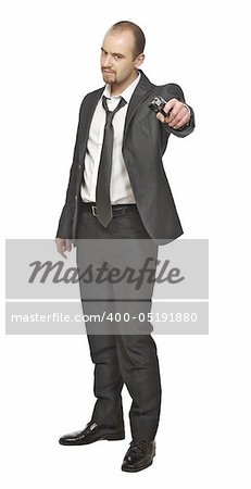portrait of young businessman standing with pistol isolated on white