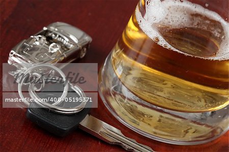 Car key and a glass of beer