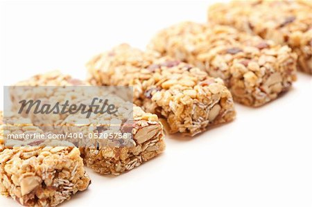 Row of Several Granola Bars Isolated on a White Background with Narrow Depth of Field.
