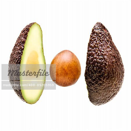 avacado sliced on white background with stone in centre