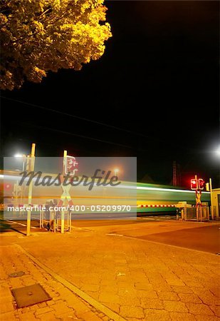 Railroad crossing at night of a Metro (U-Bahn) in Bad Homburg Ober-Eschbach near Frankfurt, Germany