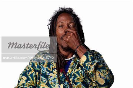 Rasta man pinches his nose due to a bad smell