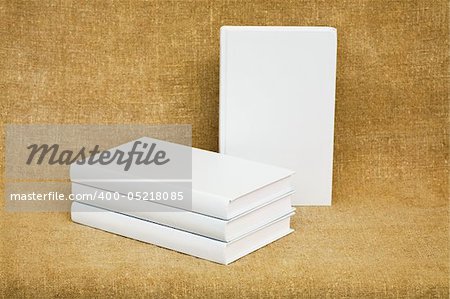 Several books on the background of brown canvas