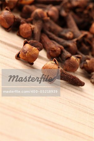 Closeup of cloves on a wooden table. Shallow dof, selective focus