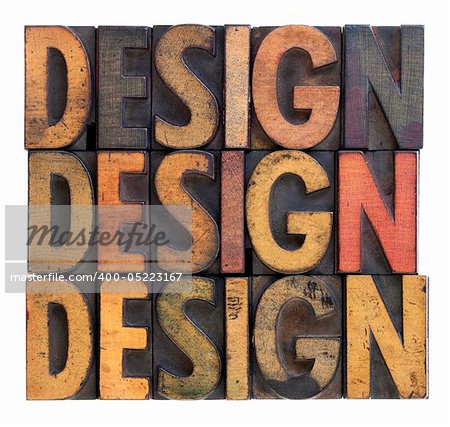 the word design (three versions) in vintage wood letterpress block types, stained by ink, isolated on white