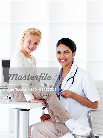 Adorable little girl attending a medical check-up in a medical practice